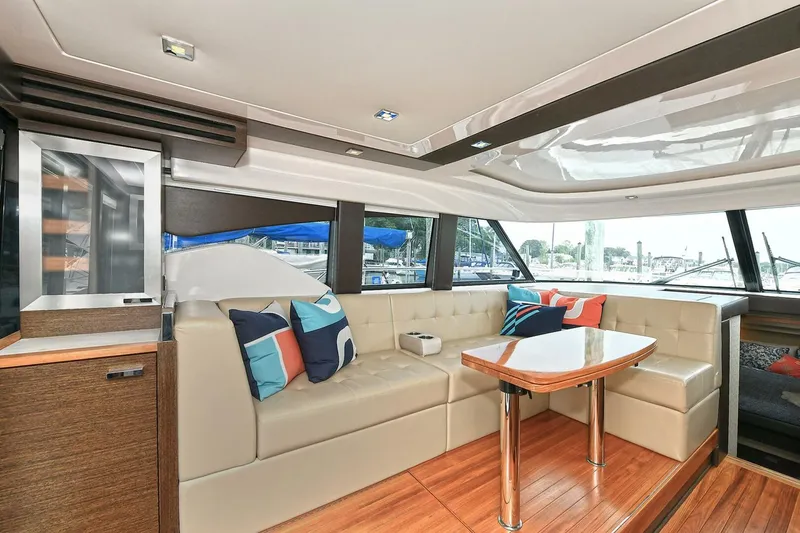  Yacht Photos Pics Luxurious interior of 2015 Tiara Yachts C44 Coupe with plush seating and modern design.