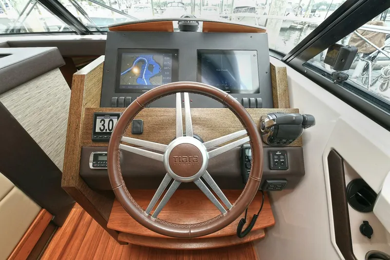  Yacht Photos Pics Helm of 2015 Tiara Yachts C44 Coupe with modern navigation displays and controls.