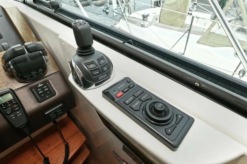  Yacht Photos Pics Control panel of a 2015 Tiara Yachts C44 Coupe with joystick and navigation controls.