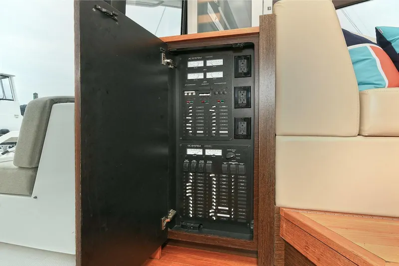  Yacht Photos Pics Electrical panel inside 2015 Tiara Yachts C44 Coupe, showcasing circuit breakers and controls.