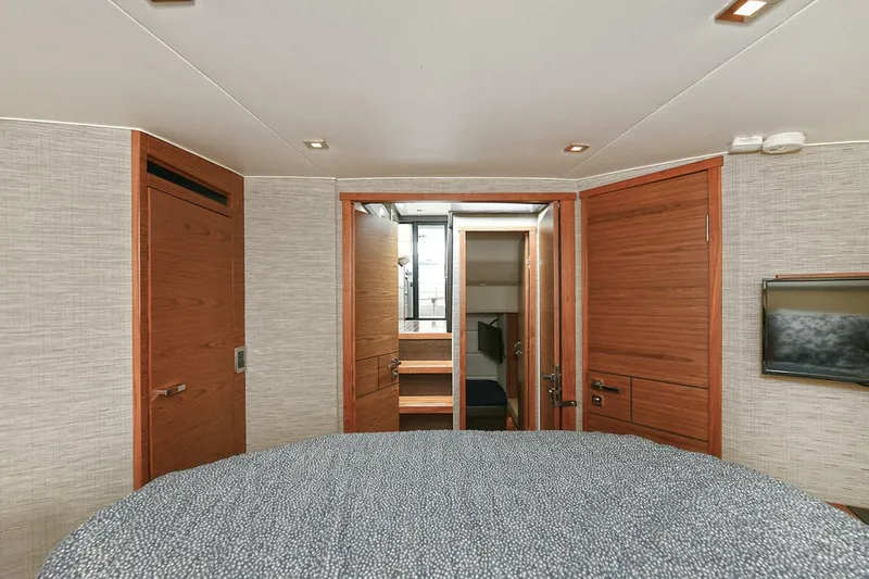  Yacht Photos Pics Interior of 2015 Tiara Yachts C44 Coupe, featuring a cozy cabin with wooden finishes.