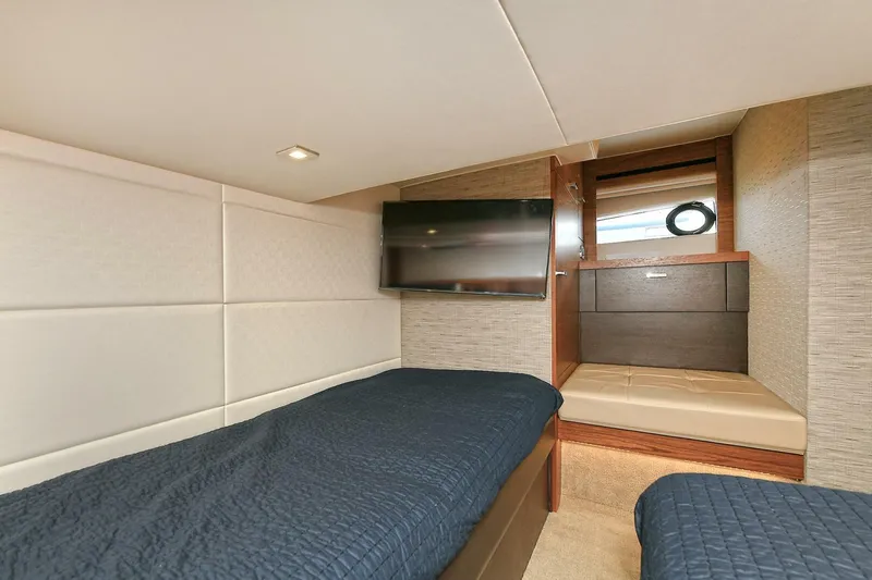  Yacht Photos Pics Interior cabin of 2015 Tiara Yachts C44 Coupe with twin beds and TV.