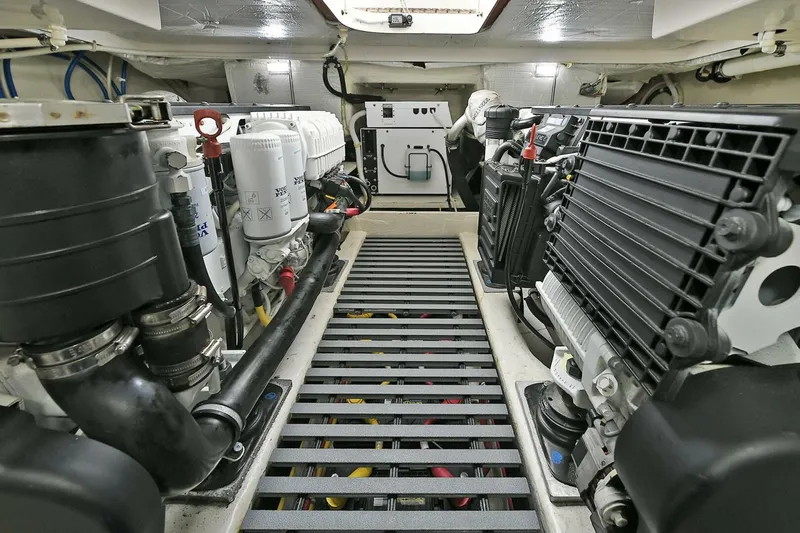  Yacht Photos Pics Engine room of 2015 Tiara Yachts C44 Coupe, showcasing mechanical components and systems.