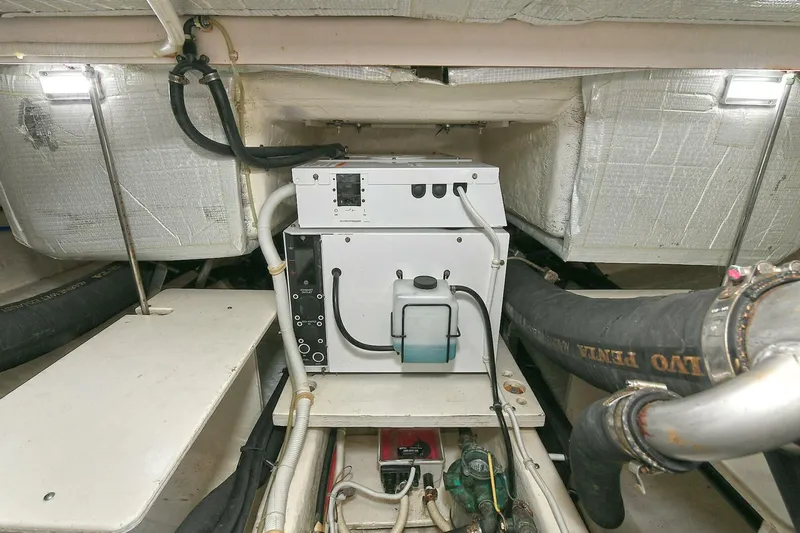  Yacht Photos Pics Engine room of 2015 Tiara Yachts C44 Coupe, showcasing mechanical components and wiring.