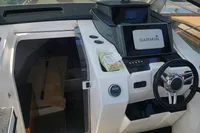 2022 Karnic CS 700HT boat interior with Garmin navigation system and steering wheel.