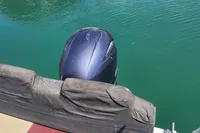 Outboard motor on a 2022 Karnic CS 700HT boat in clear water.
