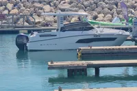 2022 Karnic CS 700HT boat docked in a marina with Yamaha outboard motor.