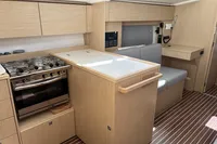 2024 Bavaria C38 yacht interior with modern kitchen and seating area.