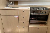 Modern kitchen in 2024 Bavaria C38 yacht with stove and sink.