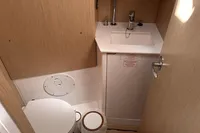 2024 Bavaria C38 yacht bathroom with modern sink and toilet.
