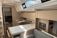 Modern interior of 2024 Bavaria C38 yacht, featuring sleek kitchen and control panel.