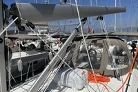 2024 Bavaria C38 sailboat with rigging and cockpit, docked in a marina.