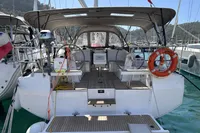 2024 Bavaria C38 yacht with spacious cockpit, docked in a marina.