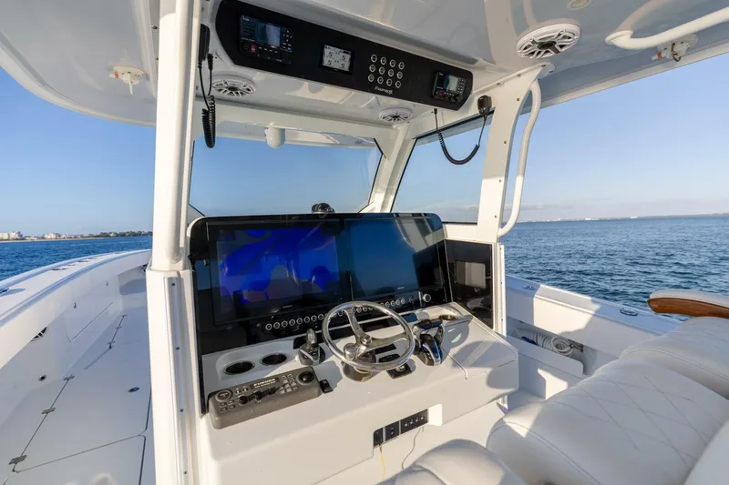 Just Looking Yacht Photos Pics 2024 Freeman 47 boat cockpit with advanced navigation system and ocean view.