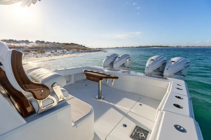 Just Looking Yacht Photos Pics 2024 Freeman 47 boat with Yamaha engines near a sandy beach.