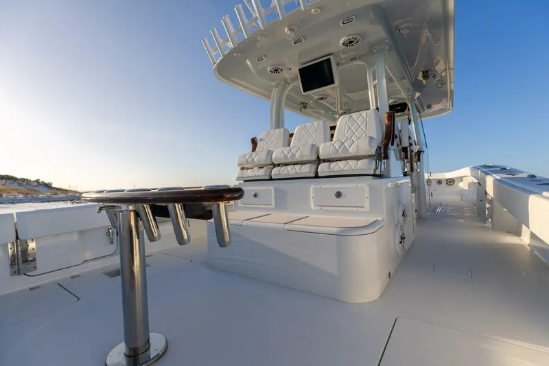 Just Looking Yacht Photos Pics Luxurious 2024 Freeman 47 boat interior with plush seating and sleek design.