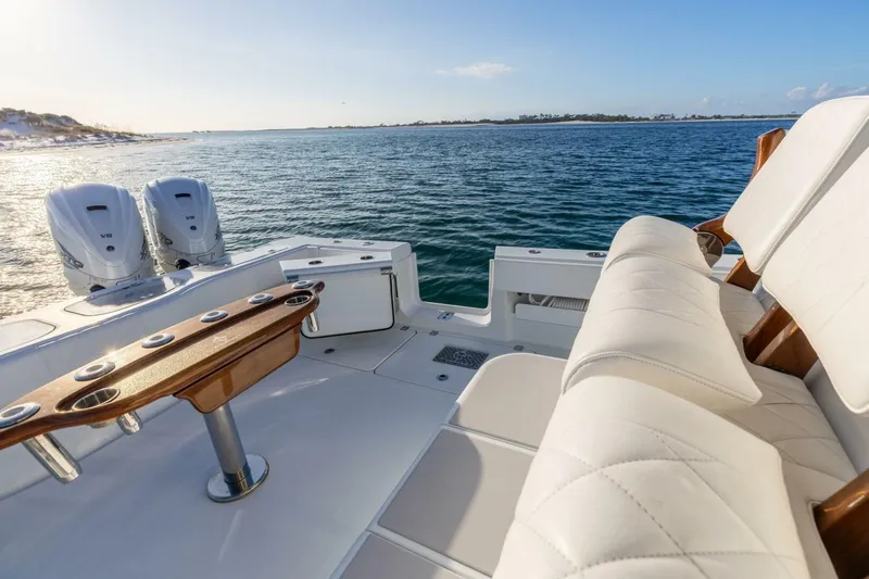 Just Looking Yacht Photos Pics Luxurious 2024 Freeman 47 boat interior with plush seating and dual engines on open water.