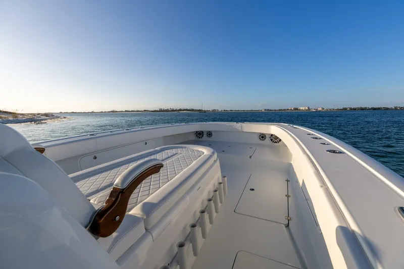 Just Looking Yacht Photos Pics 2024 Freeman 47 boat on calm water, featuring spacious deck and seating.