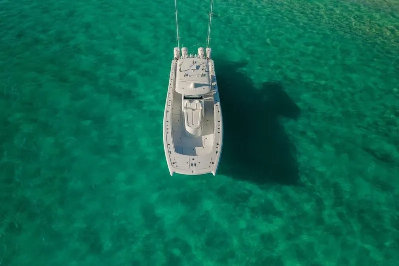 Just Looking Yacht Photos Pics Aerial view of 2024 Freeman 47 boat on clear turquoise water.