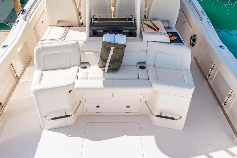  Yacht Photos Pics Manufacturer Provided Image: 2022 Grady-White Canyon 456 boat interior with white seating and storage compartments.