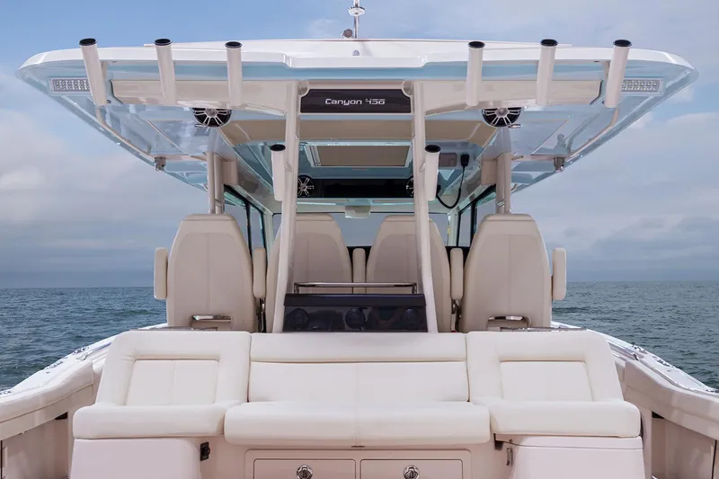  Yacht Photos Pics Manufacturer Provided Image: 2022 Grady-White Canyon 456 boat interior with luxurious seating and ocean backdrop.