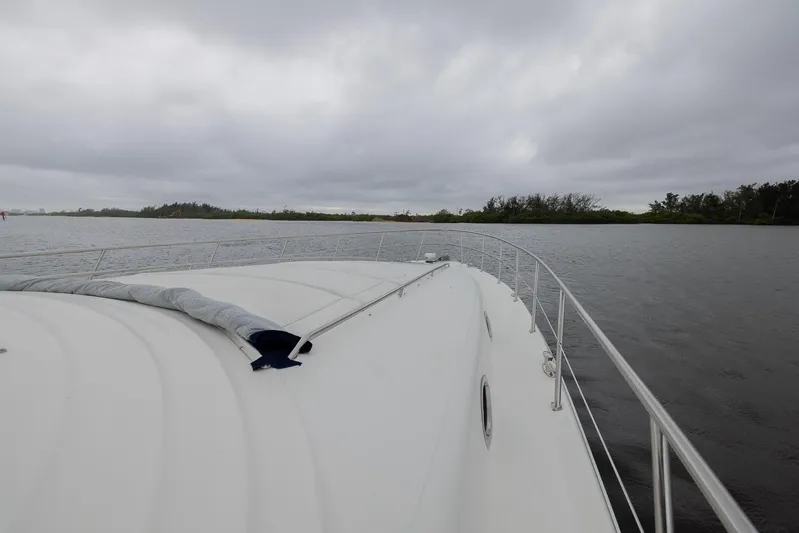 Paulay D Yacht Photos Pics 2005 Sea Ray 600 Sun Sport yacht on calm waters under cloudy skies.