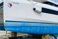 Leopard 45 catamaran on blocks, 2020 model, with blue hull and white deck.