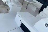 Spacious deck of 2020 Leopard 45 catamaran with seating and table.