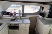 Modern kitchen interior of 2020 Leopard 45 catamaran with appliances and ample counter space.