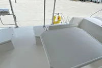 Leopard 45 catamaran deck, 2020 model, docked near a marina with scenic water views.