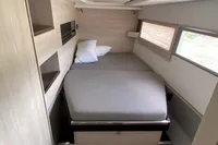 Interior of 2020 Leopard 45 yacht cabin with bed and storage.