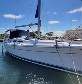 Light Seeker Yacht Photos Pics 2005 Hunter 41 AC sailboat docked on a sunny day.