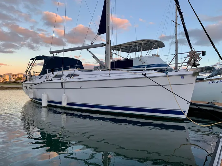 Light Seeker Yacht Photos Pics Sailboat Hunter 41 AC 2005 docked at sunset with calm water reflections.