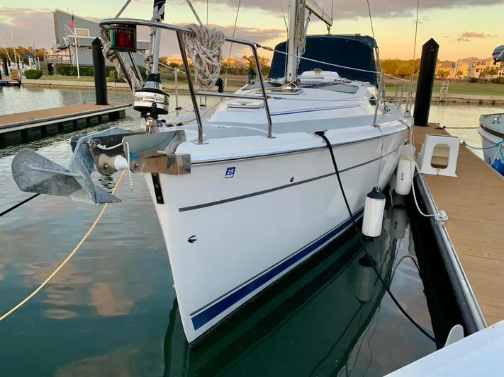 Light Seeker Yacht Photos Pics 2005 Hunter 41 AC sailboat docked at marina during sunset.