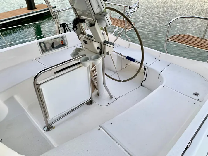 Light Seeker Yacht Photos Pics Cockpit of 2005 Hunter 41 AC sailboat with steering wheel and seating.