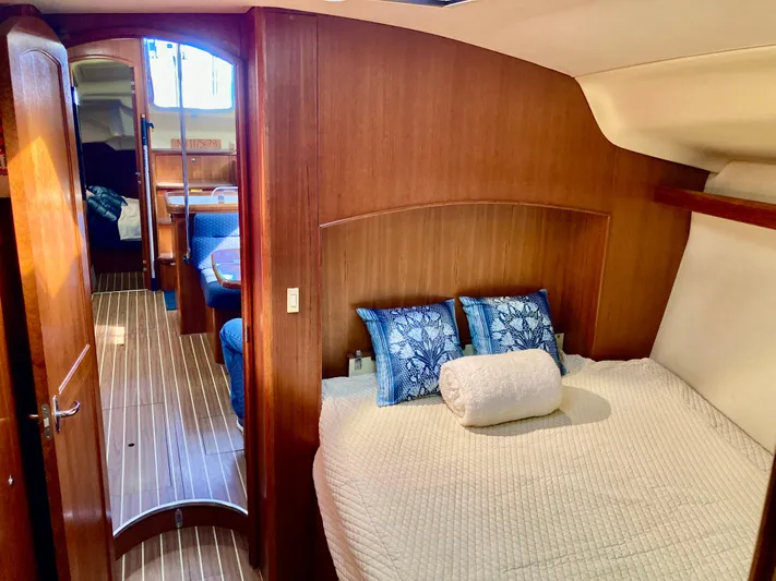 Light Seeker Yacht Photos Pics Luxurious interior of 2005 Hunter 41 AC yacht with cozy bedroom and elegant wood finish.