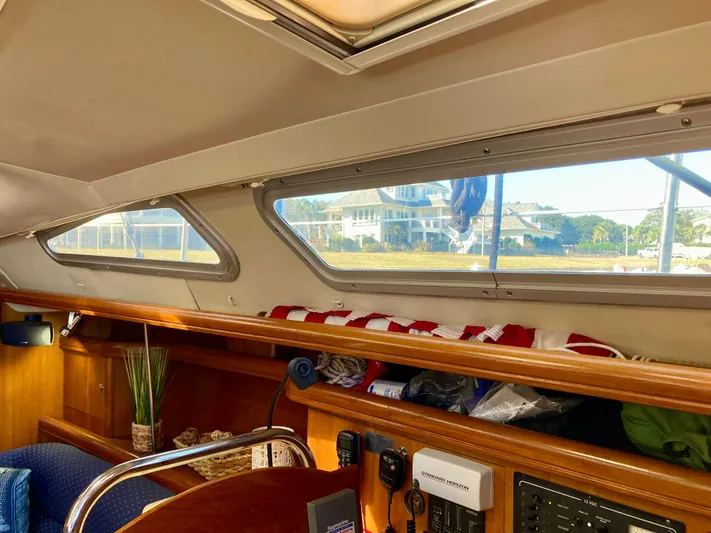 Light Seeker Yacht Photos Pics Interior of 2005 Hunter 41 AC sailboat with windows and wooden cabinetry.