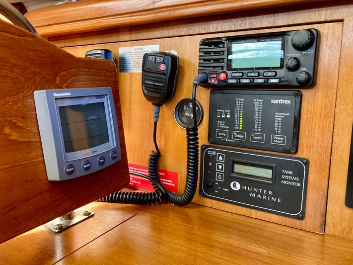 Light Seeker Yacht Photos Pics Control panel of a 2005 Hunter 41 AC sailboat with navigation and monitoring systems.