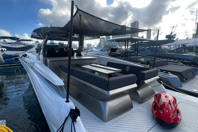  Yacht Photos Pics 2023 Canados 493 Gladiator yacht docked, featuring sleek design and modern amenities.