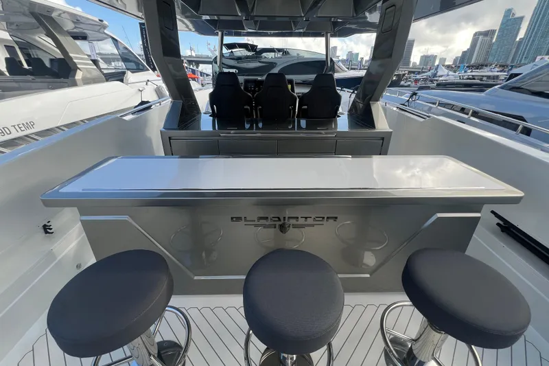  Yacht Photos Pics 2023 Canados 493 Gladiator yacht interior with sleek bar and seating.
