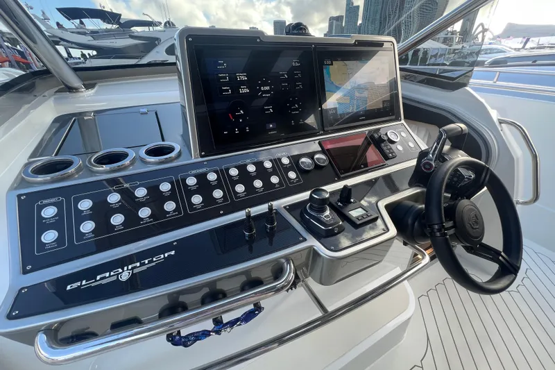  Yacht Photos Pics 2023 Canados 493 Gladiator yacht helm with advanced navigation controls and dual displays.