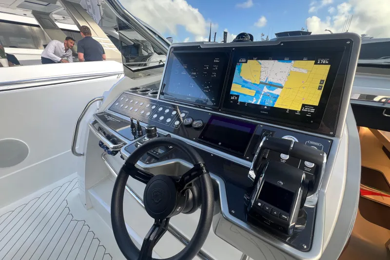  Yacht Photos Pics 2023 Canados 493 Gladiator yacht helm with advanced navigation displays and controls.
