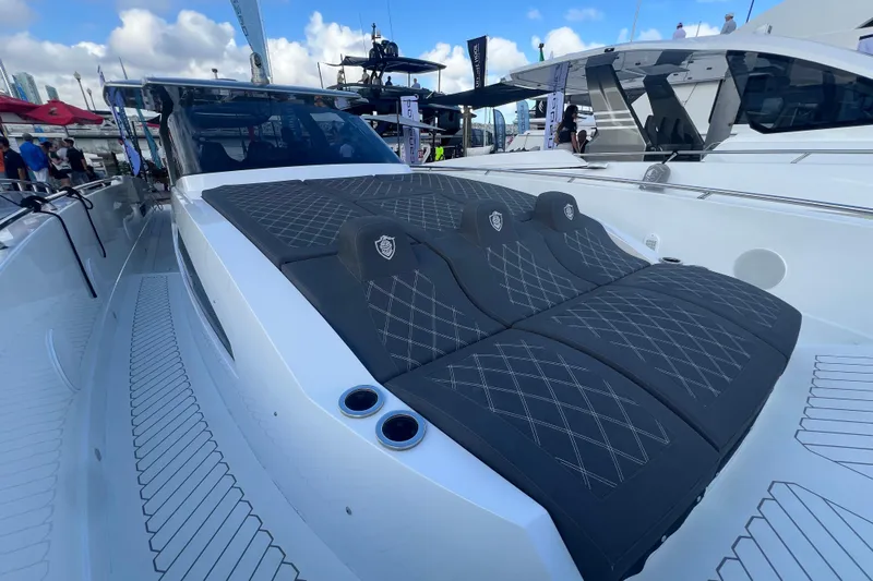  Yacht Photos Pics 2023 Canados 493 Gladiator luxury yacht with sleek design and spacious sunbathing area.