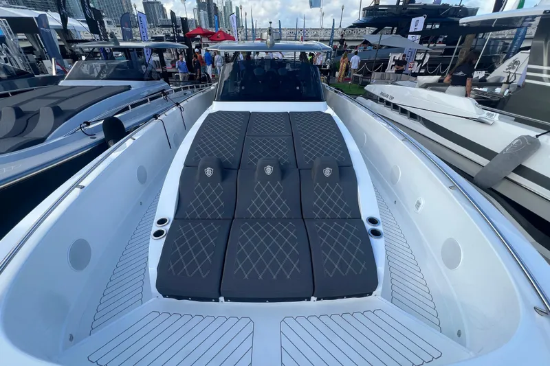  Yacht Photos Pics 2023 Canados 493 Gladiator luxury yacht with sleek design and spacious sunbathing area.