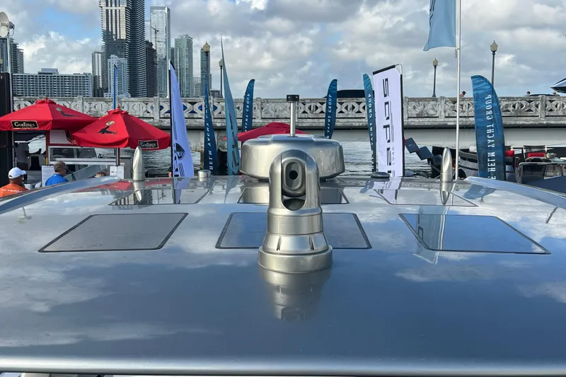  Yacht Photos Pics 2023 Canados 493 Gladiator yacht with city skyline and flags in the background.