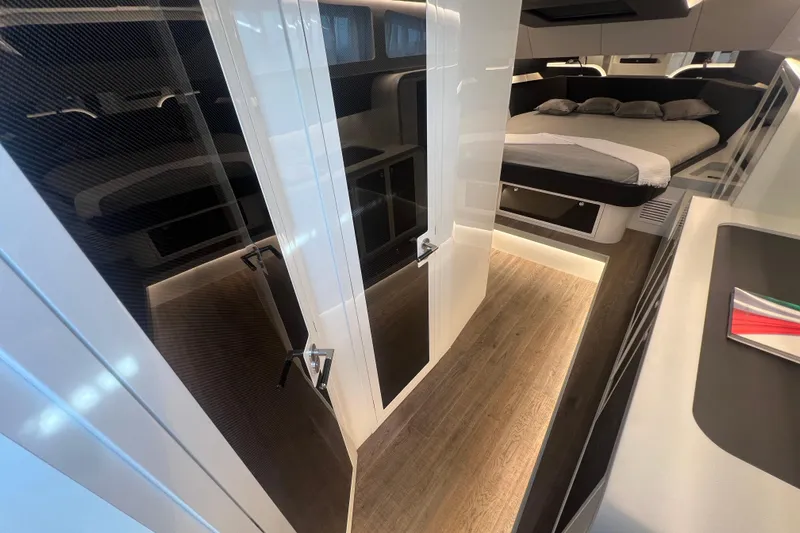  Yacht Photos Pics Luxurious interior of 2023 Canados 493 Gladiator yacht with modern design and cozy bedroom.