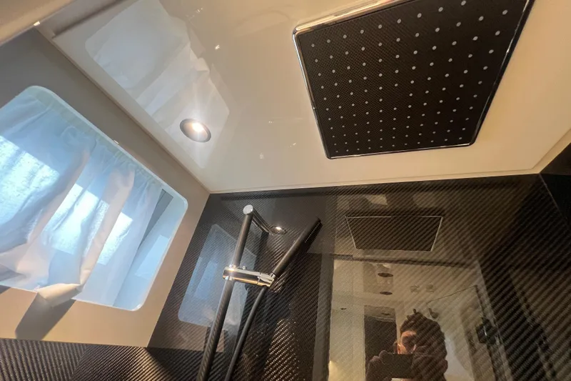  Yacht Photos Pics Luxurious bathroom interior of 2023 Canados 493 Gladiator yacht with modern shower design.