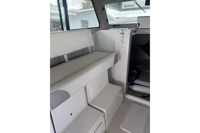  Yacht Photos Pics 2024 Parker 2820 XLD Sport Cabin interior with seating and storage.