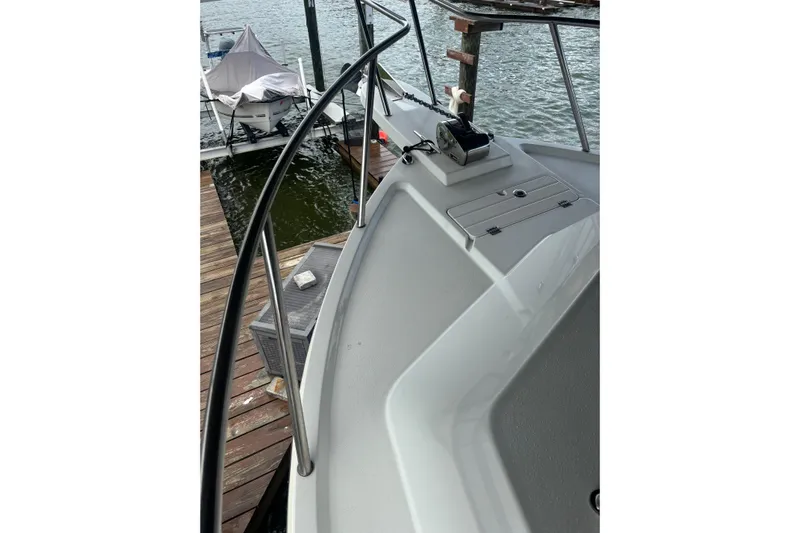  Yacht Photos Pics 2024 Parker 2820 XLD Sport Cabin boat docked by the water.