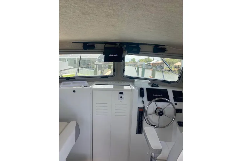 Yacht Photos Pics 2024 Parker 2820 XLD Sport Cabin interior with Garmin navigation system.